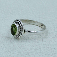 Oval faceted citrine or peridot sterling silver ring with beaded bezel