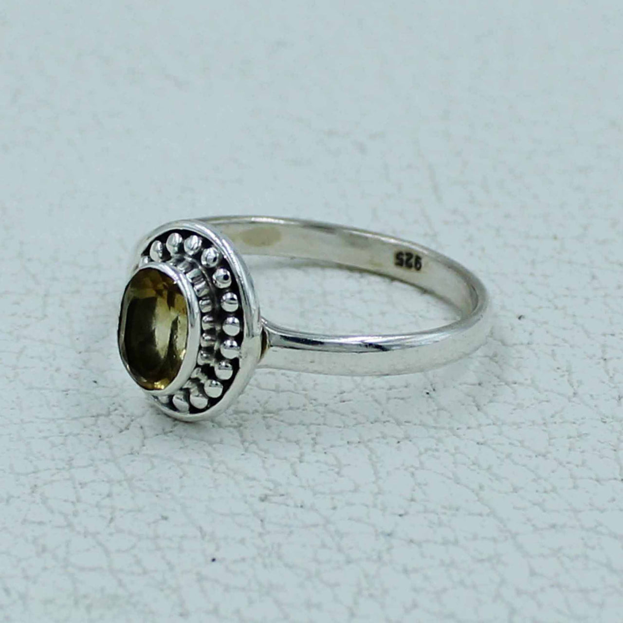 Oval citrine bezel-set sterling silver ring with beaded border BC0407