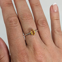 Thumbnail for A woman’s hand with a Citrine Stackable Dainty Ring in .925 Sterling Silver