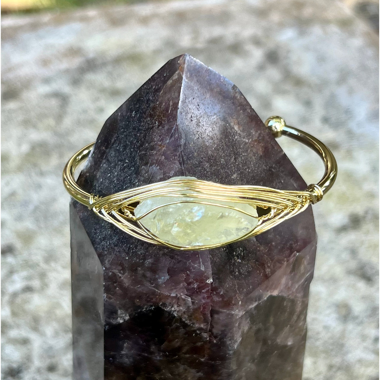 Gold wire-wrapped Citrine Third Eye gemstone ring with purple Amethyst crystal point