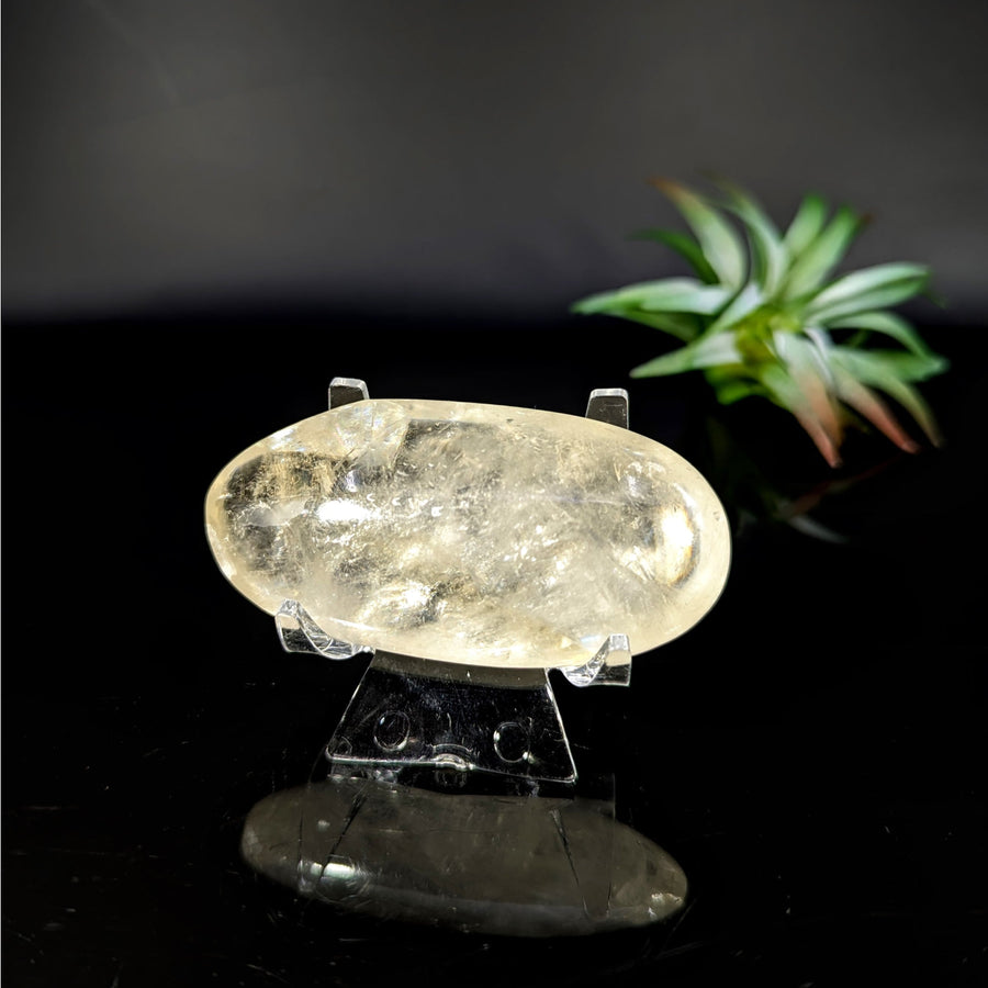 Translucent yellow oval Calcite palm stone for healing and meditation