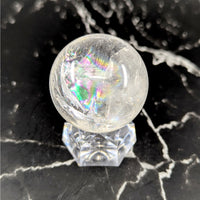 Clear iridescent quartz 1.25in small sphere #BC0891 on crystal stand
