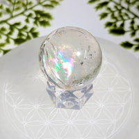 Clear quartz 1.5 inch sphere #BC1215 with iridescent inclusions