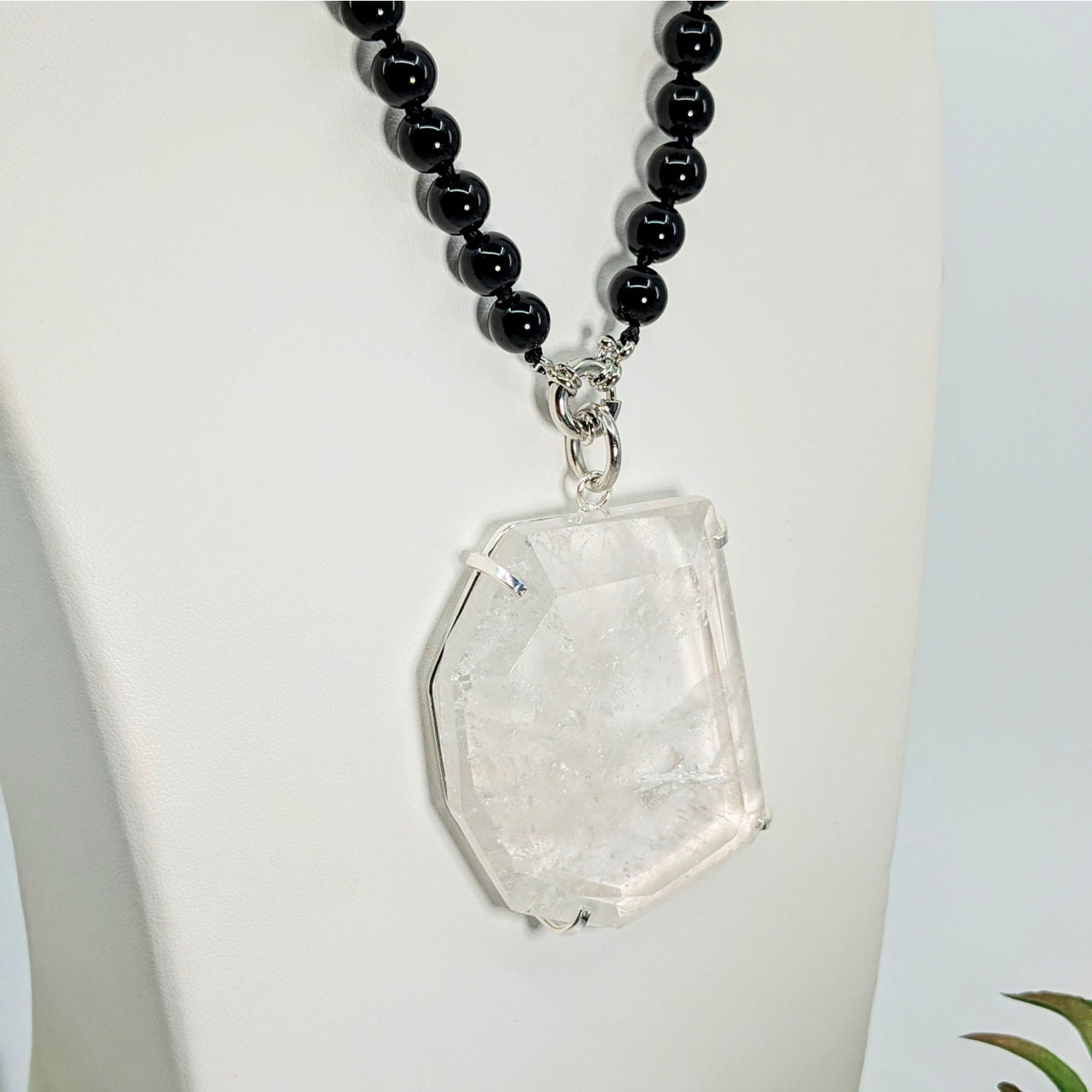 Clear Quartz 16’’ Slice Pendant on Onyx Necklace showcasing a shimmering crystal design