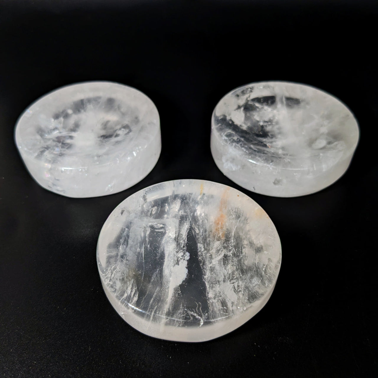 Three clear quartz spheres on black surface in Clear Quartz 2’ Sphere Holder #LV2331