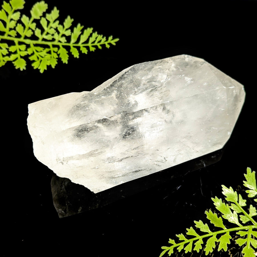 Clear quartz 5.8 inch natural point with translucent facets and internal inclusions for healing and decor