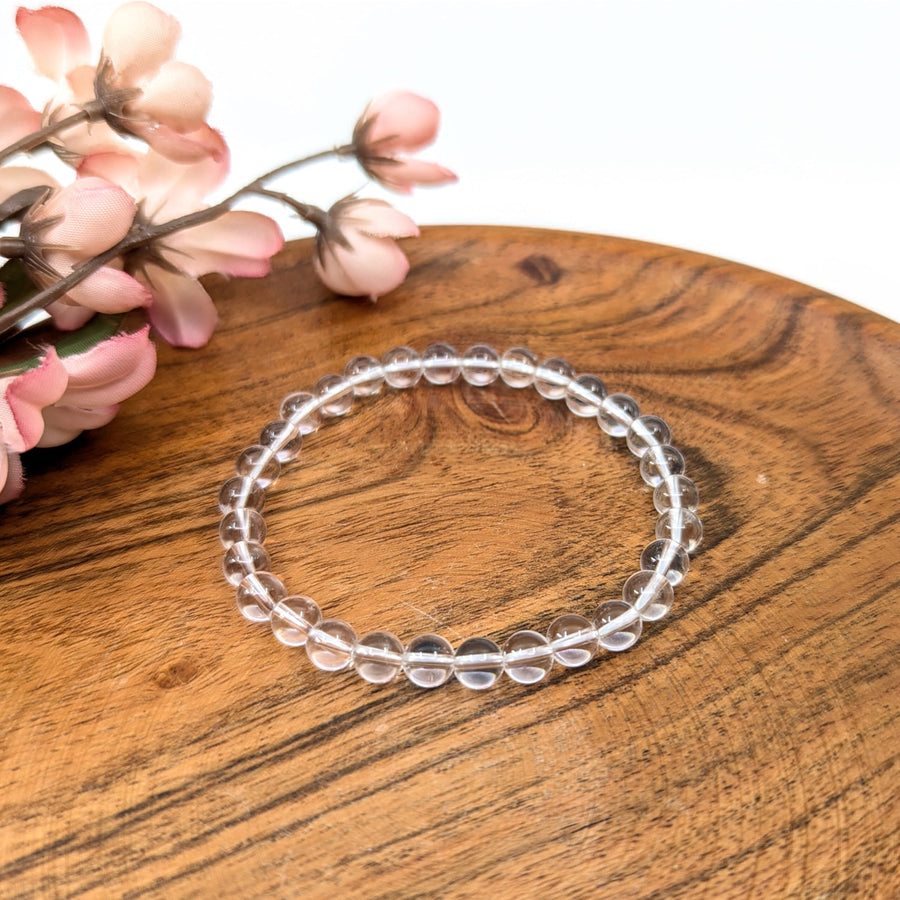 Clear quartz beaded bracelet with 6mm beads on a 7-inch string, stylish and elegant
