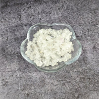 Thumbnail for A bowl of white sugar on granite counter showcasing Clear Quartz Chip Bead Assorted Size