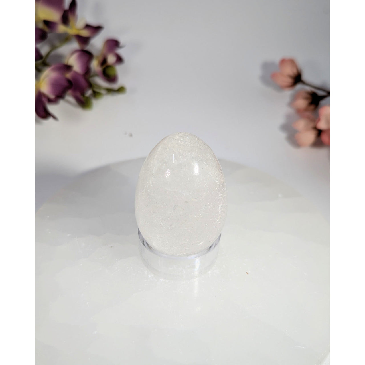 Translucent white clear quartz egg 1.5x1.75in #BC0468 on glass stand