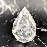 Clear quartz faceted 2.5 inch gem egg point BC0740 with rainbow reflections