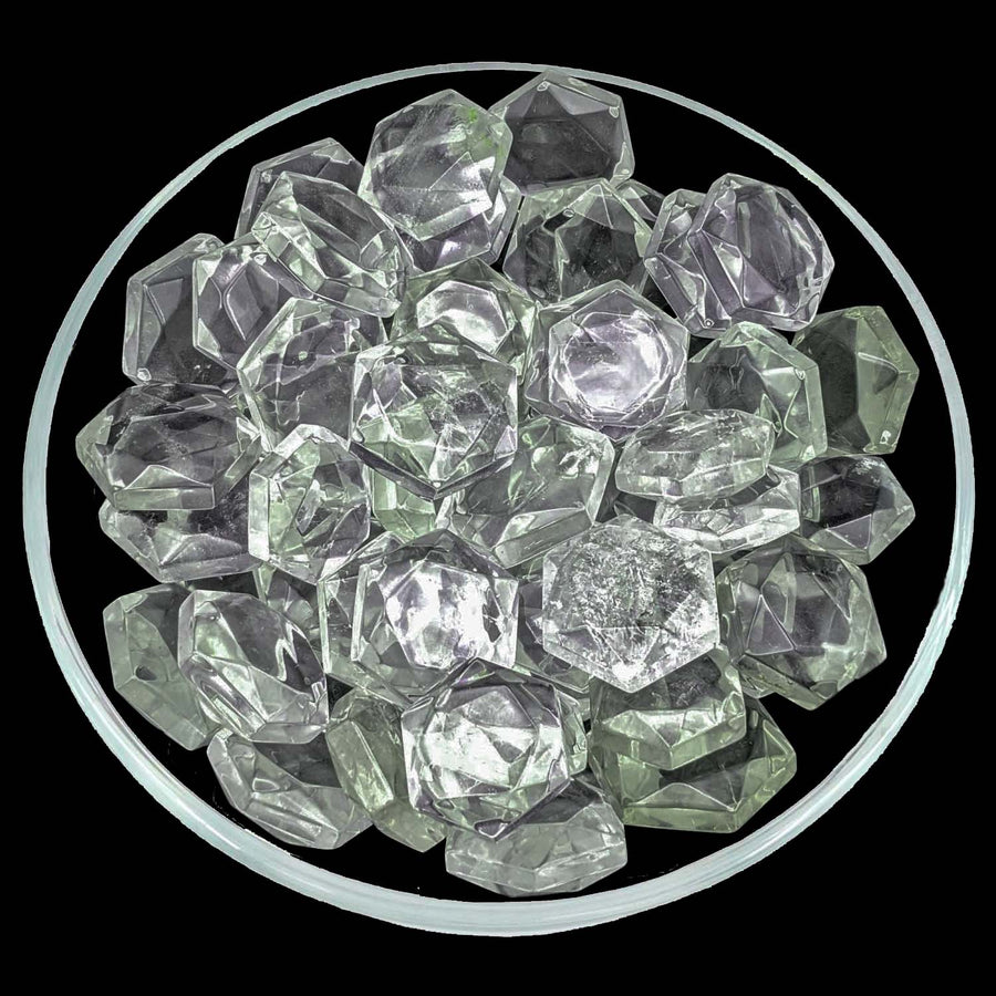 Clear and pale green ice cubes in a bowl showcasing Clear Quartz Gem Cut design
