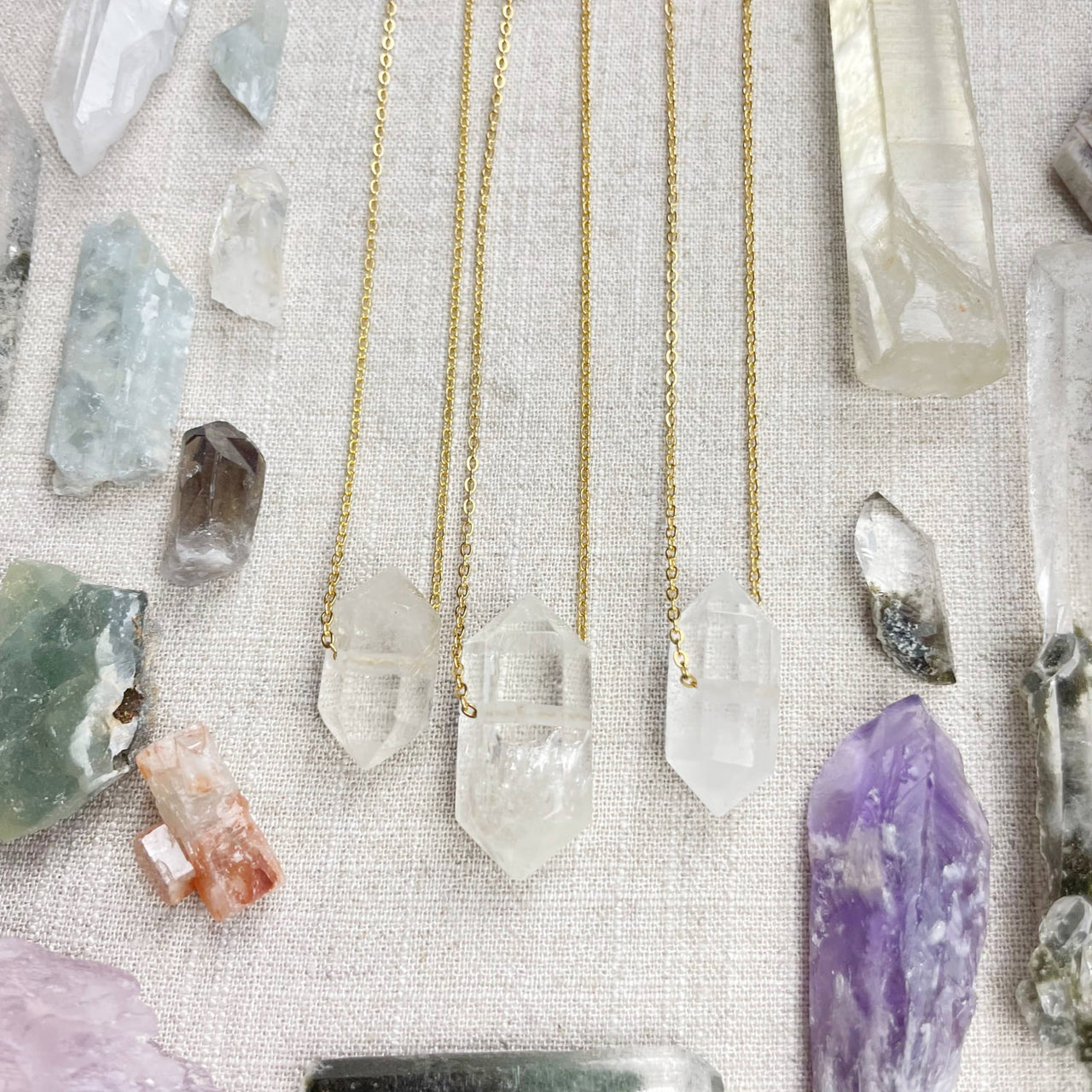 Three Clear Quartz Double Terminated Point Necklaces on Gold Chains