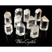 Thumbnail for Clear quartz generator points arranged with Bliss Crystals text below for energy healing