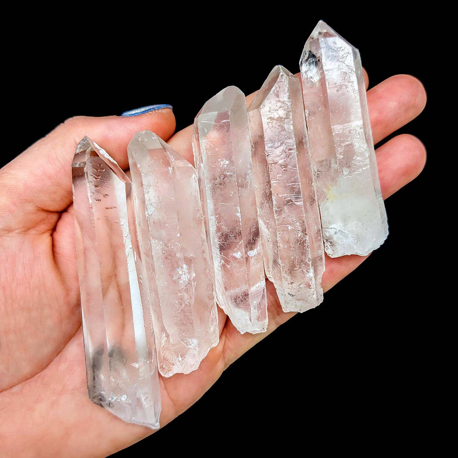 Hand holding Clear Quartz Rough Point 48g showcasing stunning quartz rough crystals