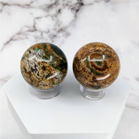 Thumbnail for Colorful Bloodstone Sphere #S062: Two glass spheres on a marble base