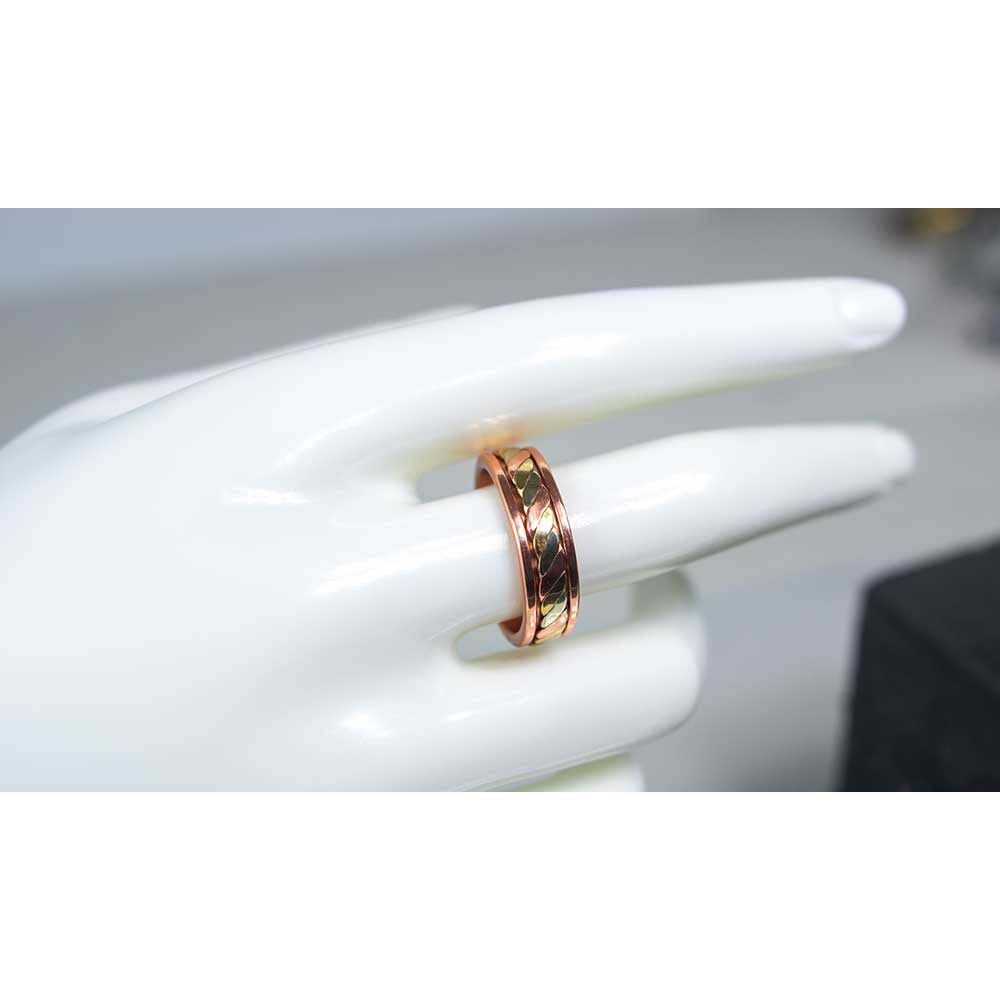 Rose gold copper adjustable magnetic 3 metal twist ring on mannequin hand