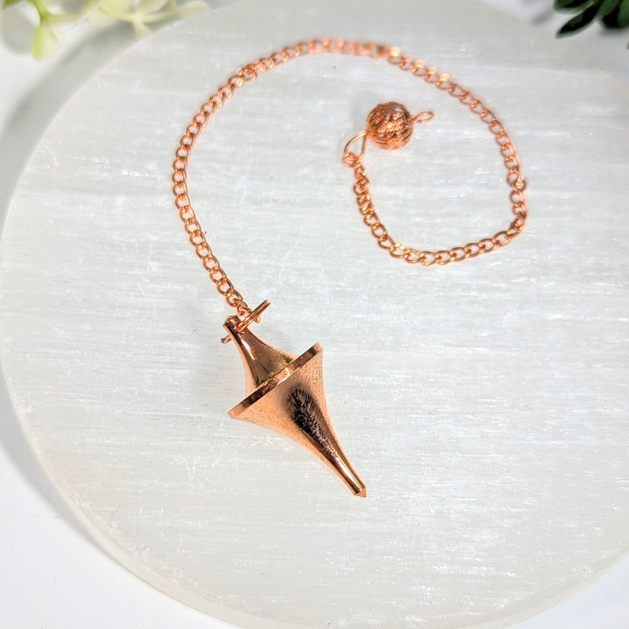Rose gold-toned copper metal 1.5 inch pendulum with faceted pointed design and chain ideal for crystals and gemstones jewelry