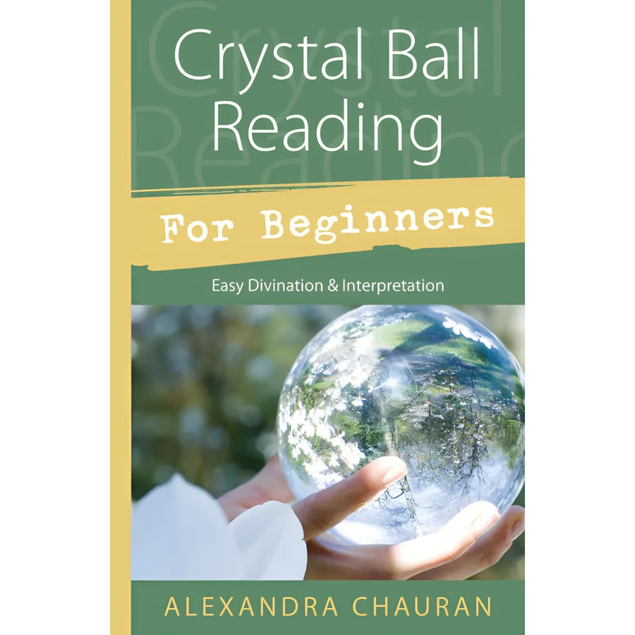 Person holding a crystal ball from the ’Crystal Ball Reading for Beginners’ book