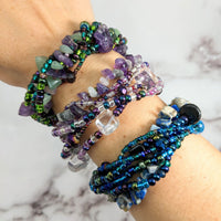 Thumbnail for Woman wearing Crystal Beaded 6 Strand bracelet featuring green aventurine and black tourmaline