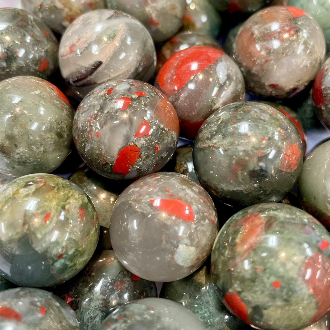 Polished African bloodstone beads with red and grey patterns in Crystal Marble S015