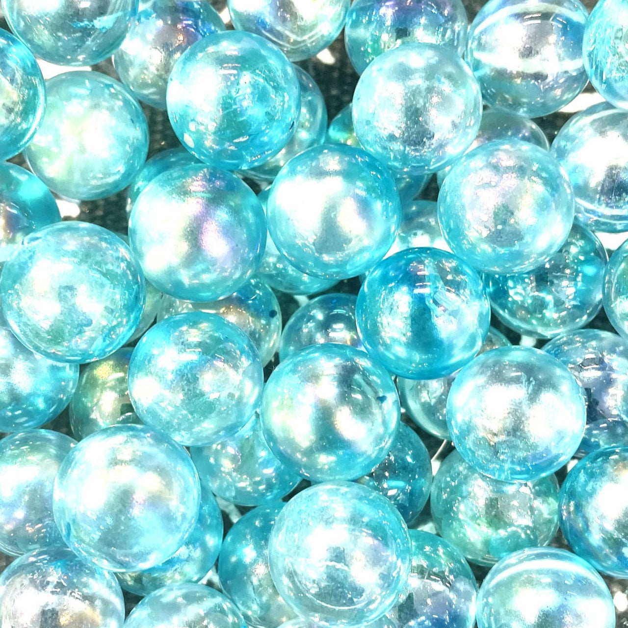 Shimmering aqua blue glass marbles with iridescent finish, Crystal Marble S015, rose quartz