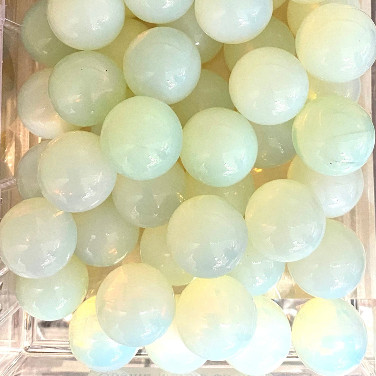 Pale translucent spheres resembling Rose Quartz marbles in Crystal Marble S015