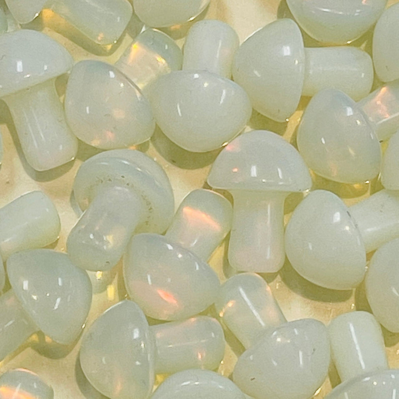 Translucent white mushroom beads with a pearly sheen from Crystal Mushroom C041