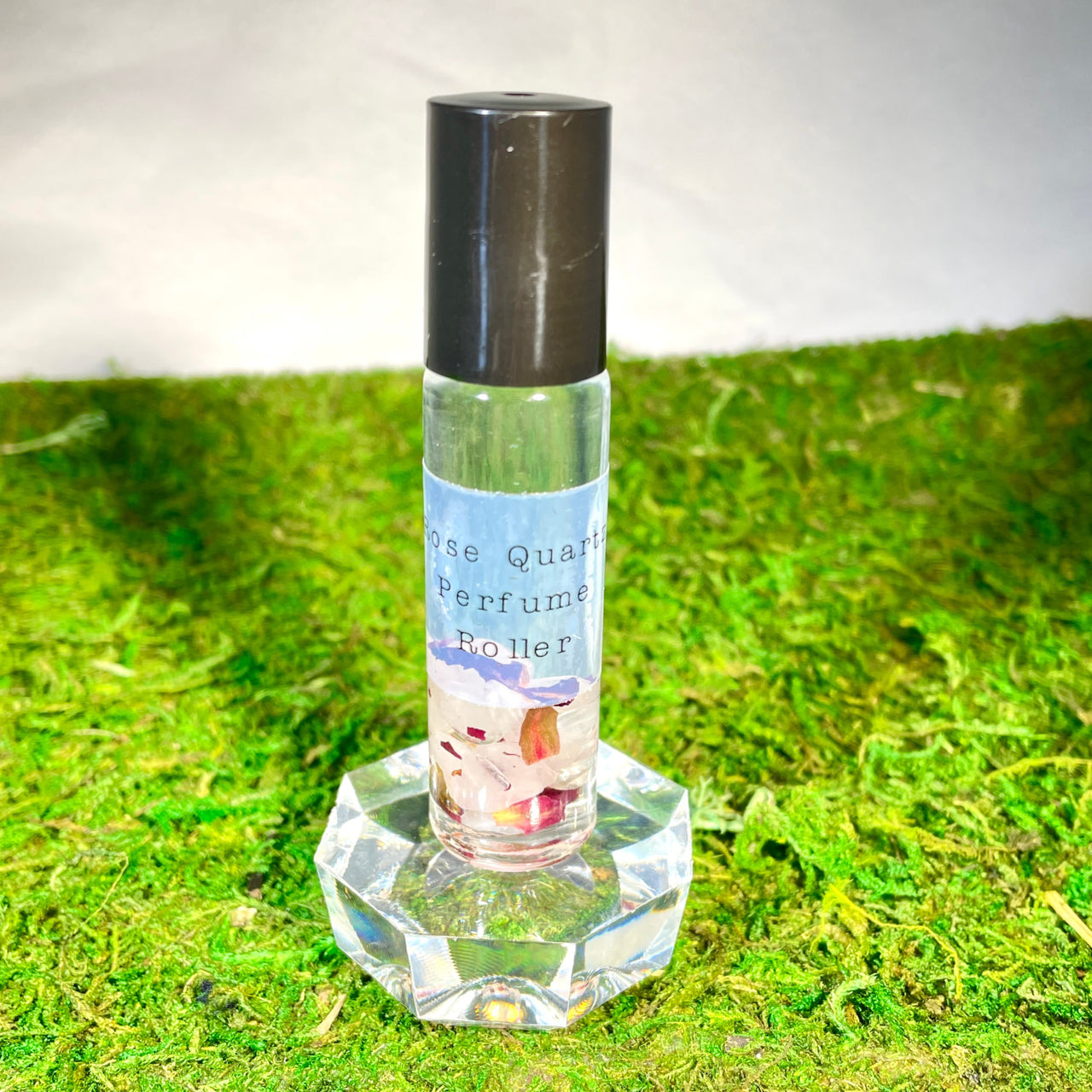 Crystal Perfume 10ml Roller #Q217 bottle on green grass