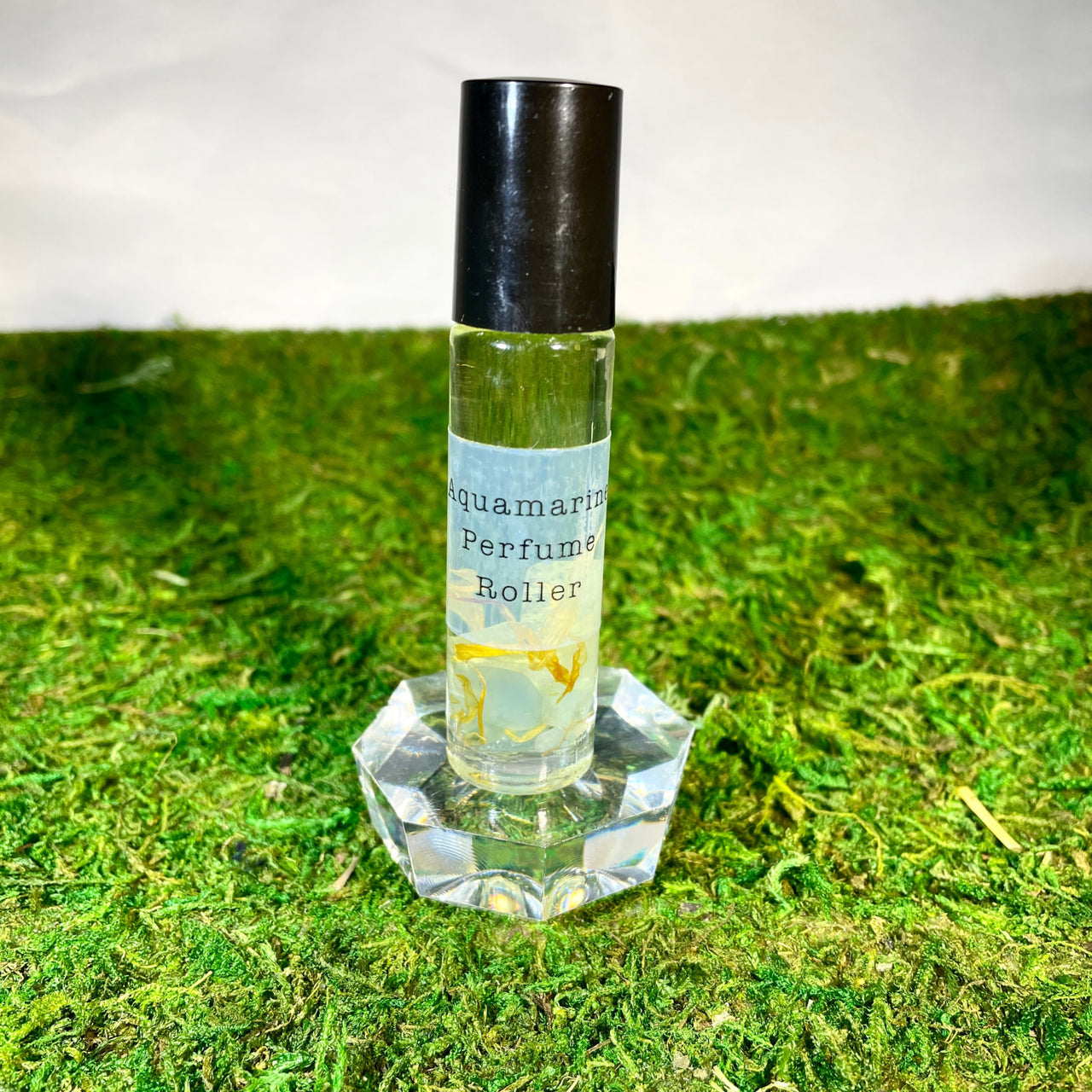 Crystal Perfume 10ml Roller #Q217 bottle on green grass, elegant and refreshing scent