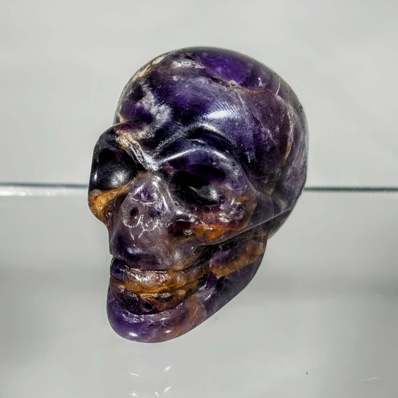 Purple and black skull with white face in Crystal Skull Carving 1-1.5’’ C077 design