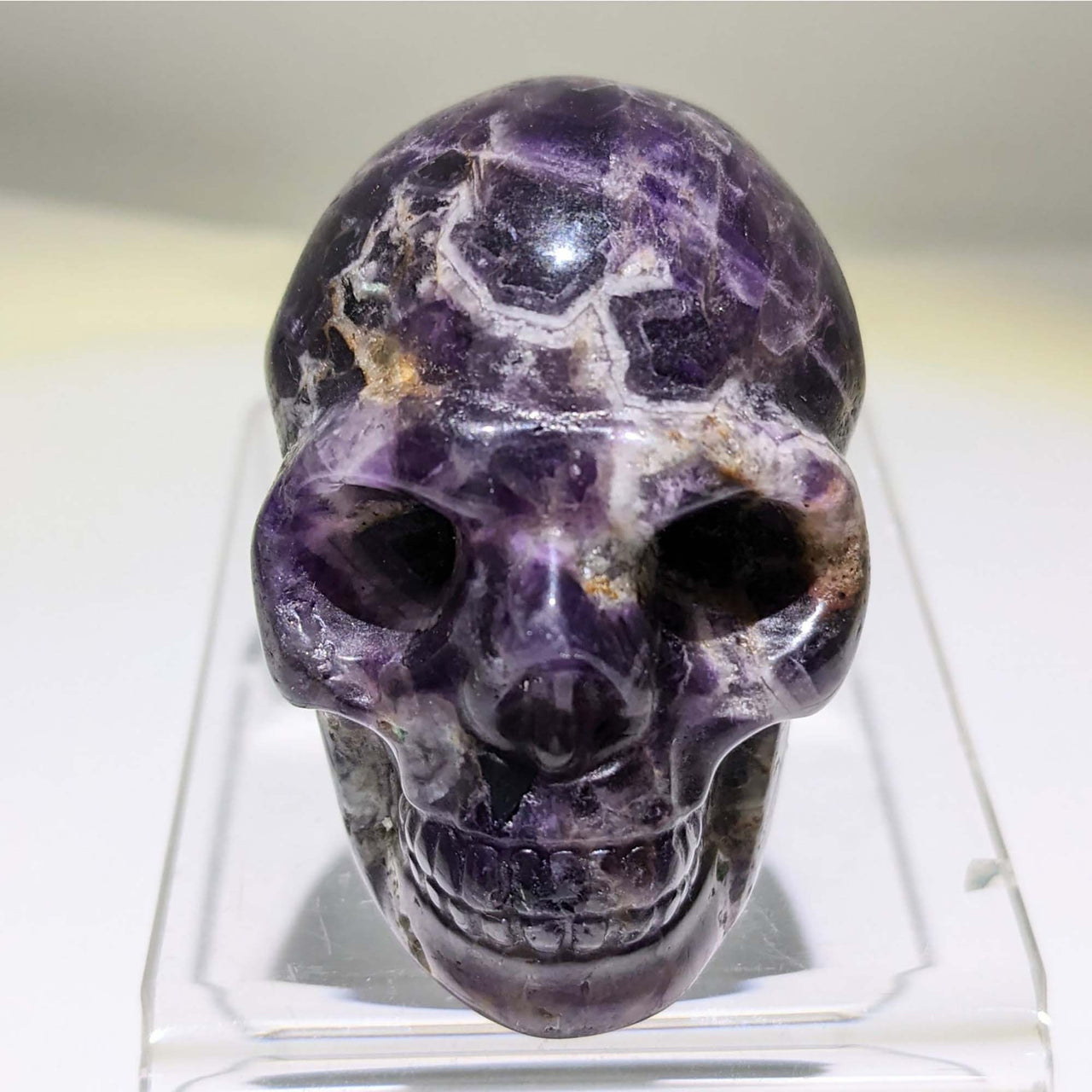 Crystal Skull Carving with Purple Stone atop a Skull for Unique Decor and Healing Energy