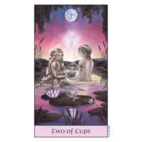 Tarot card from Crystal Visions Tarot showing two figures by a lily pond at night
