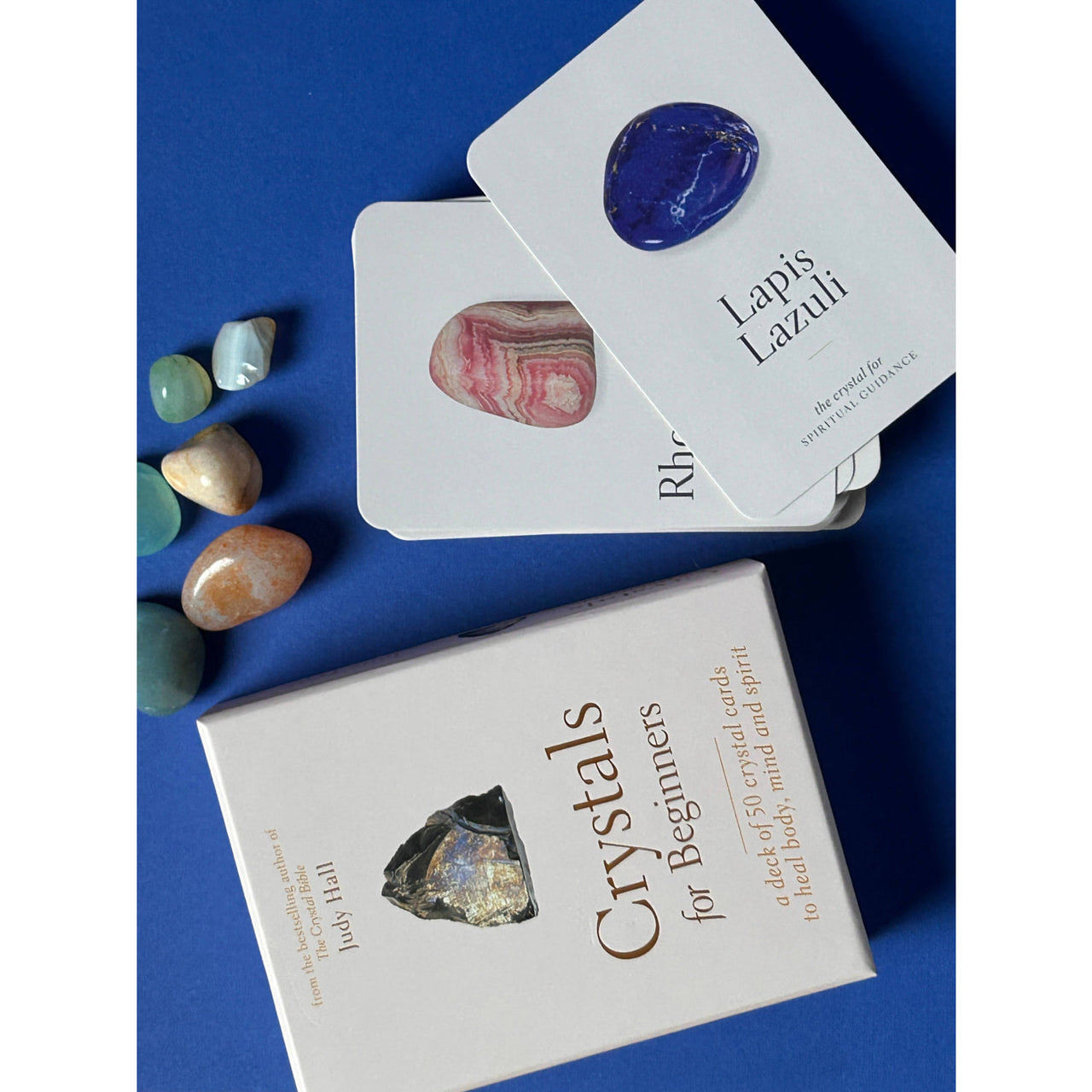 White box of Crystals For Beginners Oracle Deck by Judy Hall with crystal illustration