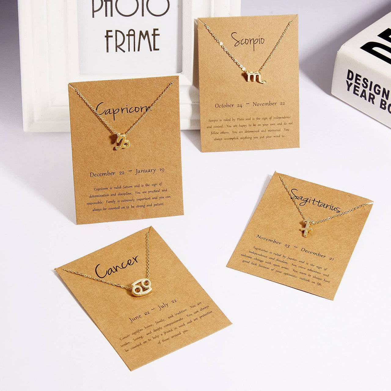 Zodiac sign necklaces on display cards in Dainty Zodiac Stainless Steel Gold Plated Necklace