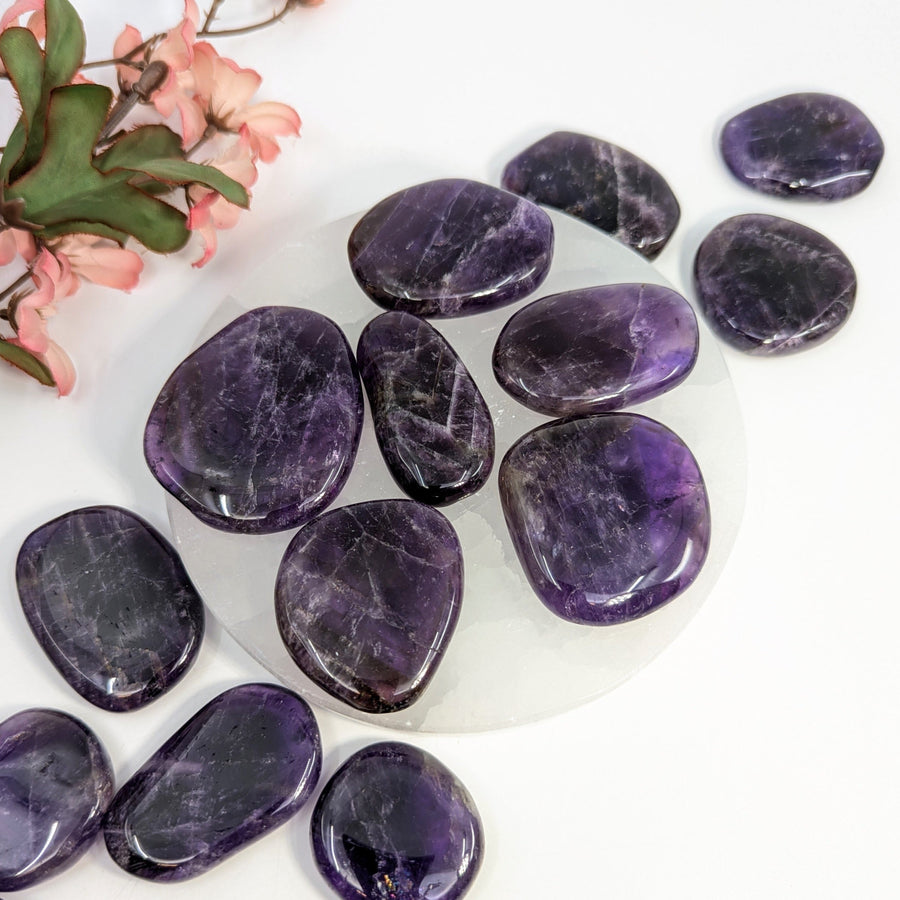 Polished dark amethyst stones from Zambia Palm with protective light shield feature