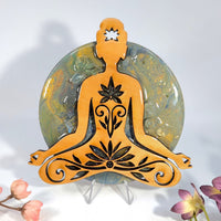 Orange wood meditation figure with black floral swirls and white star cutout, 5.5in resin tile overlay BC0379