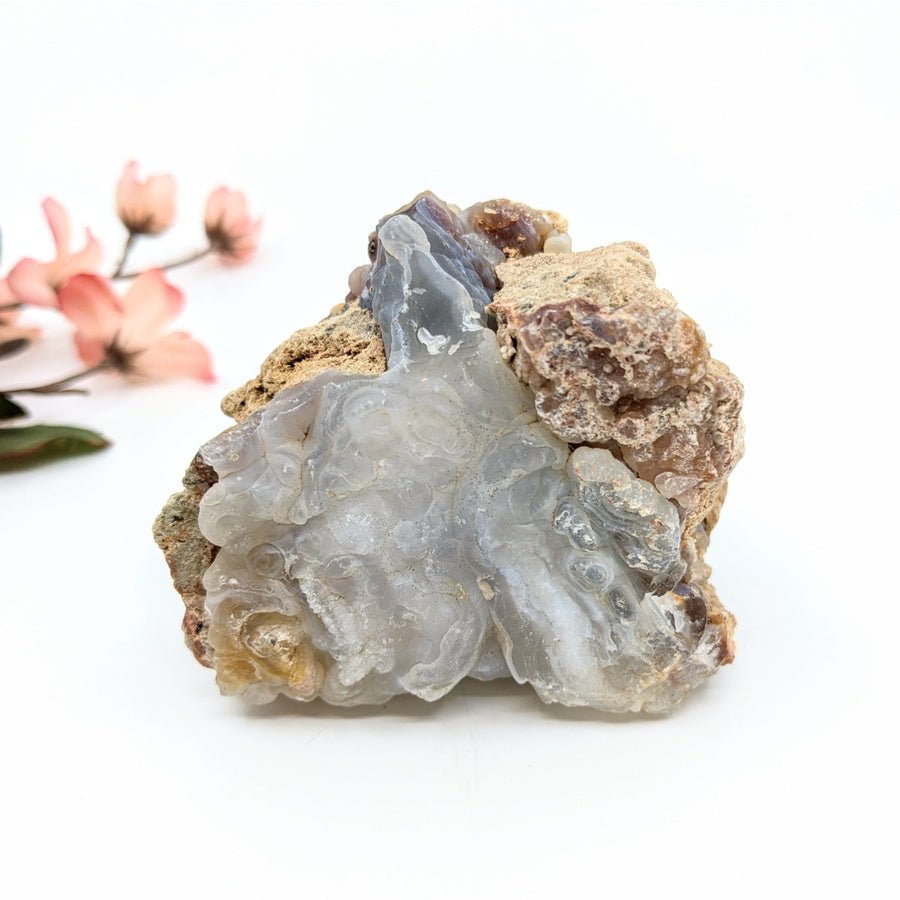 Translucent gray Deer Creek Fire Agate geode with layered patterns, 1.5-6 inch rough mixed sizes