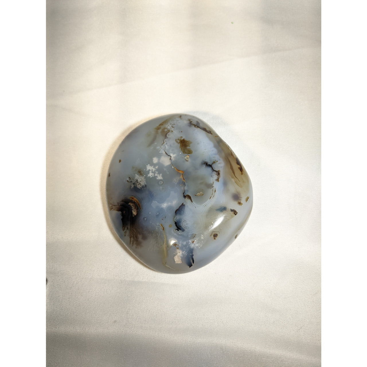 Dendrite Agate Polished Pebble with gray-blue coloring and dark inclusions, 105g