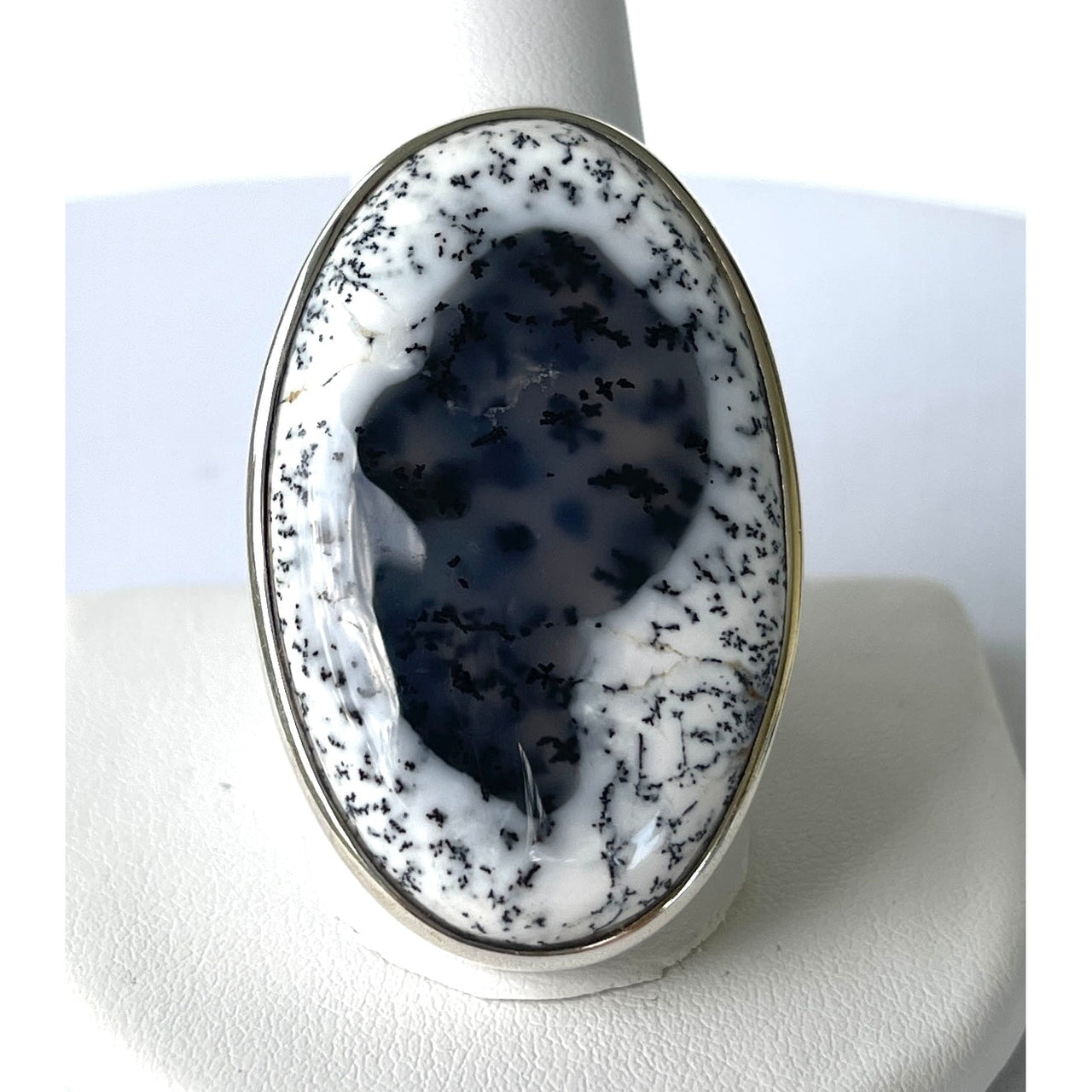 Dendritic Agate Ring: Close-up of black and white stone set in adjustable silver band