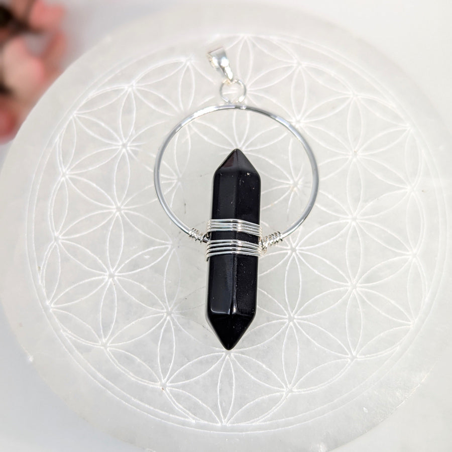 Black crystal pendant with silver wire wrap from DT Point 2’’ Wrapped Pendant #LV7911 for crystal healing jewelry