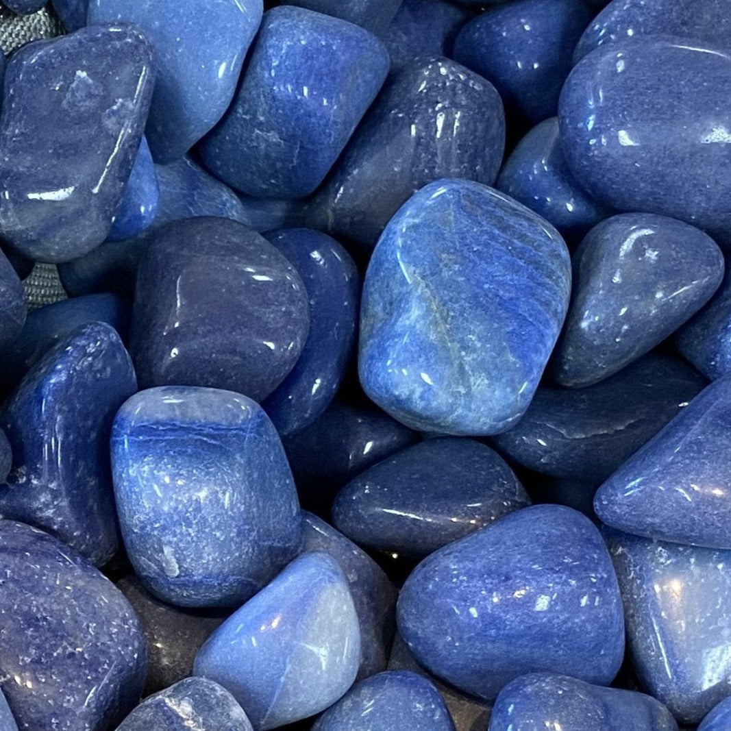 Smooth polished Dumortierite Tumbled Pebble showcasing glossy blue quartz finish