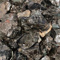 Elite noble shungite rough black metallic ore chunks with reflective surfaces and subtle golden flecks