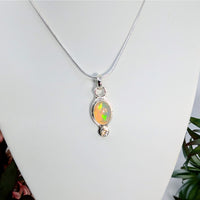 Thumbnail for Silver Ethiopian Opal Pendant with Clear Quartz and Iridescent Oval Stone