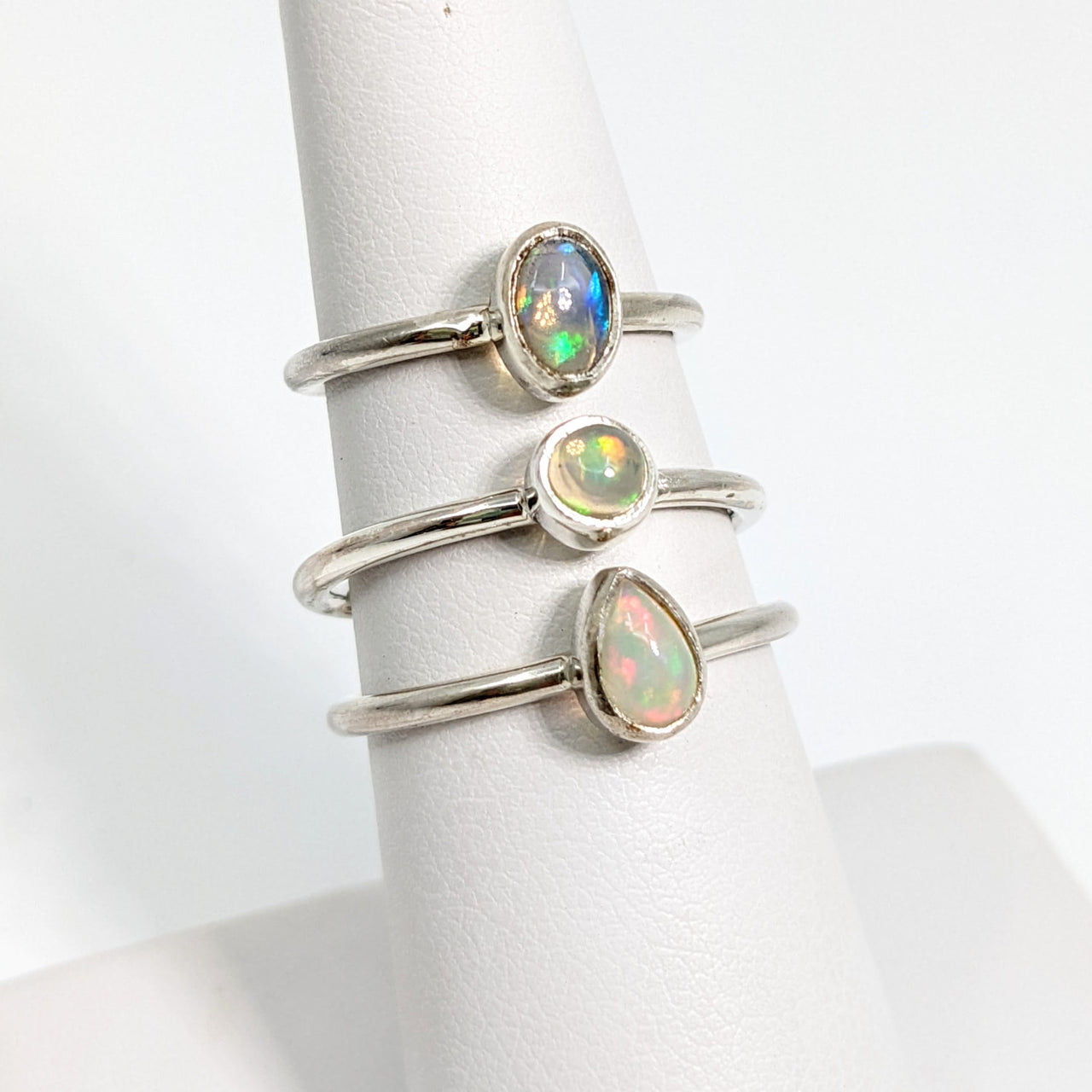 Ethiopian Opal Polished Sterling Silver Dainty Rings on a White Holder - Style #SK9025