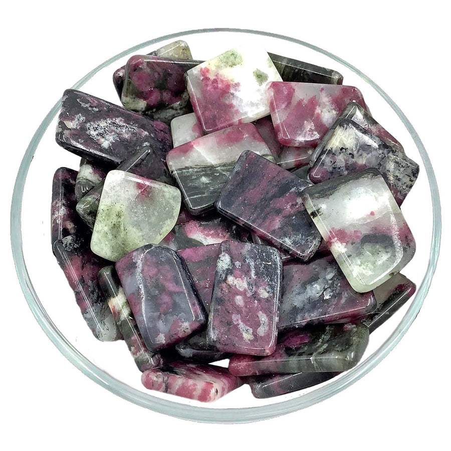 Bowl of purple and green crystals featuring Eudialyte Polished Slice Stone #TS036