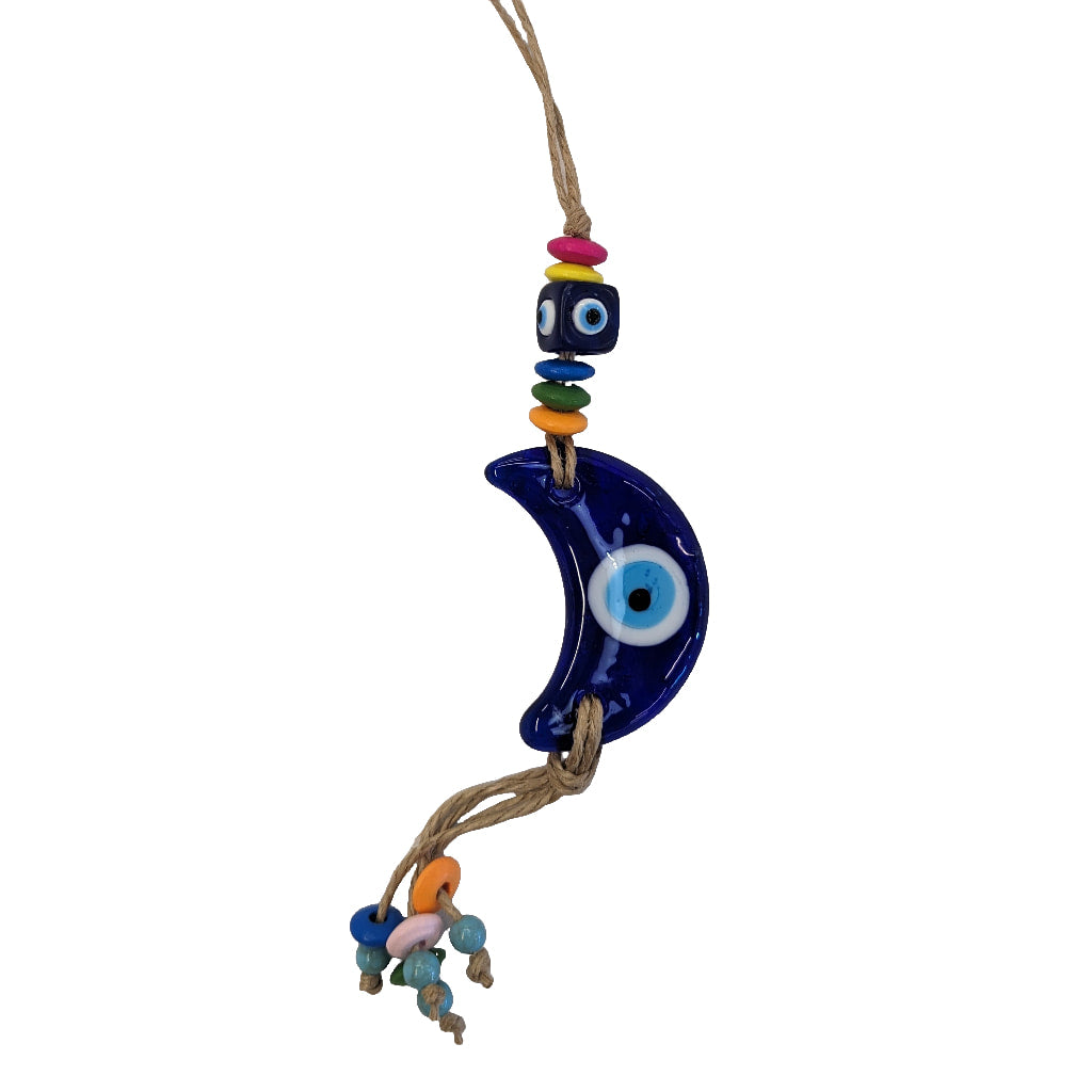 Evil eye keychain with a blue glass bird hanging on a branch for protection and decor