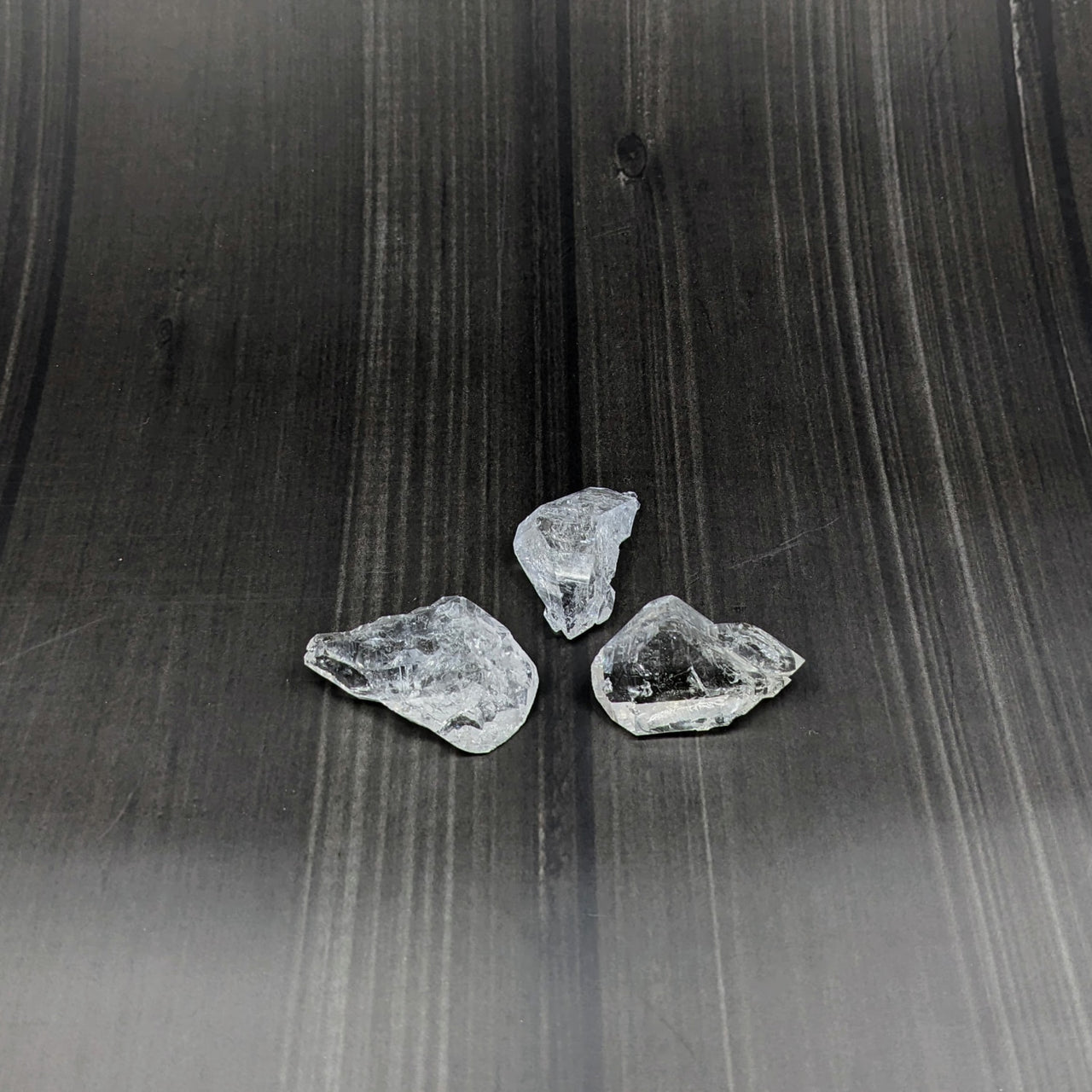 Fenster Clear Quartz Double Terminated Rough Point #SK7291 pieces on a black background