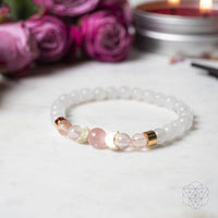 White beaded fertility bracelet with rose quartz, moonstone, and gold accents #LV9545