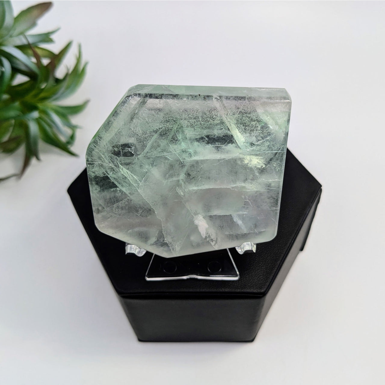 Raw Fluorite crystal in hexagonal shape, translucent green-white for item tier benefits