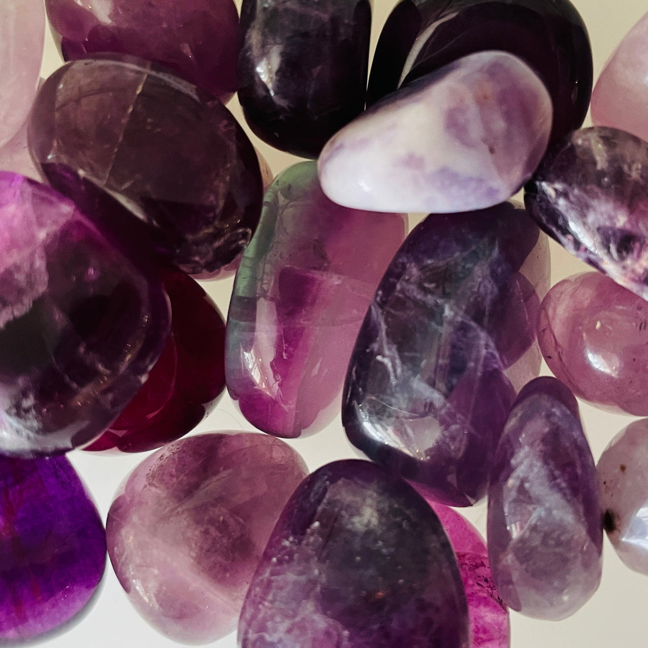 Polished purple and pink amethyst stones in Fluorite Assorted Tumbled #T316 collection